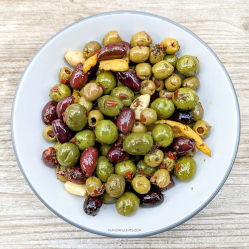 White bowl with Slow Cooker Marinated Olives