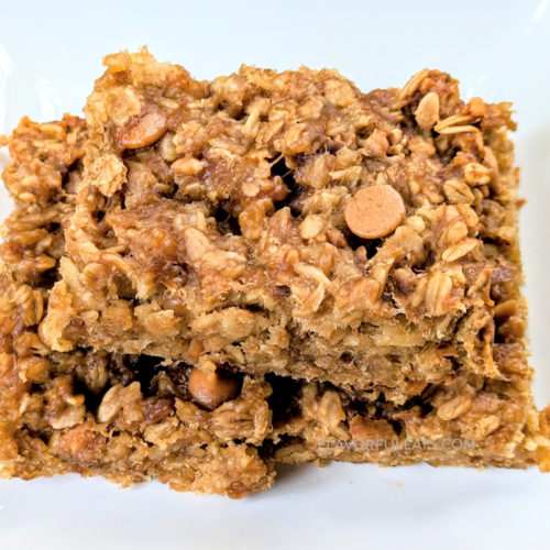 Squares of Slow Cooker Peanut Butter Banana Oatmeal Bars stacked on each other.