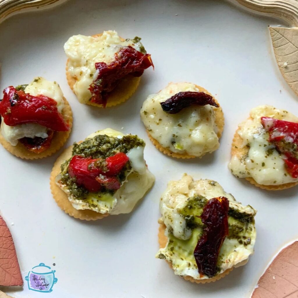 Slow Cooker Baked Brie with Pesto & Sun Dried Tomato