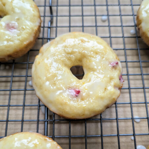 Baked Strawberry Lemon Donuts on a wire rack